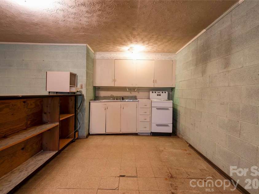 713 Pleasant Drive, Shelby, NC 28152.  MLS# CAR4355579, YatesRealty ID 27076. Basement Kitchen
