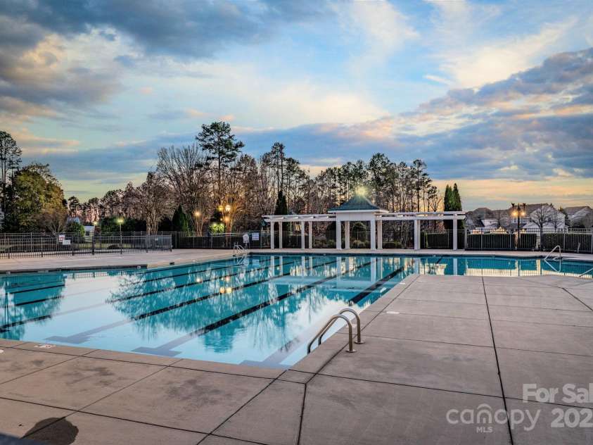 8232 Sunset Hill Road, Waxhaw, NC 28173.  MLS# CAR4274764, YatesRealty ID 27077. Gorgeous outdoor pool and splash pad new in 2025