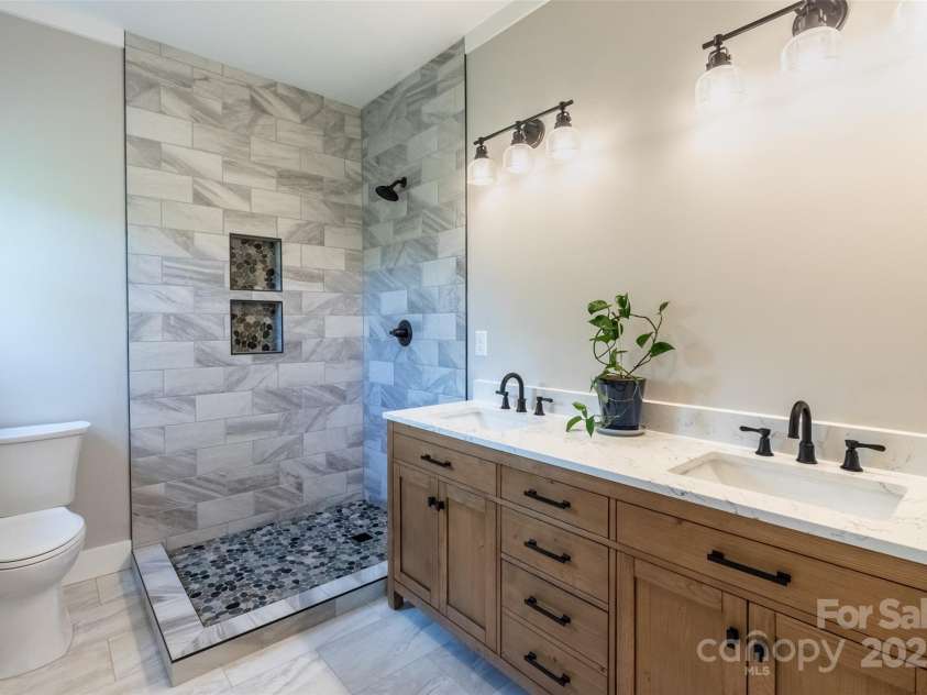 288 Blue Cedar Road, Sylva, NC 28779.  MLS# CAR4276447, YatesRealty ID 27081. Primary bath