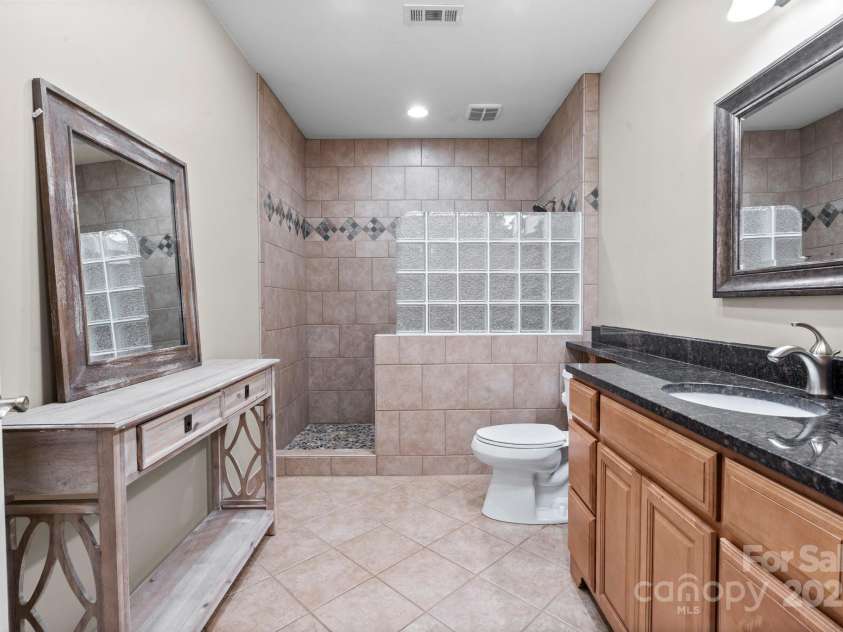 10108 Bayart Way, Huntersville, NC 28078.  MLS# CAR4280969, YatesRealty ID 27084. Full basement bathroom