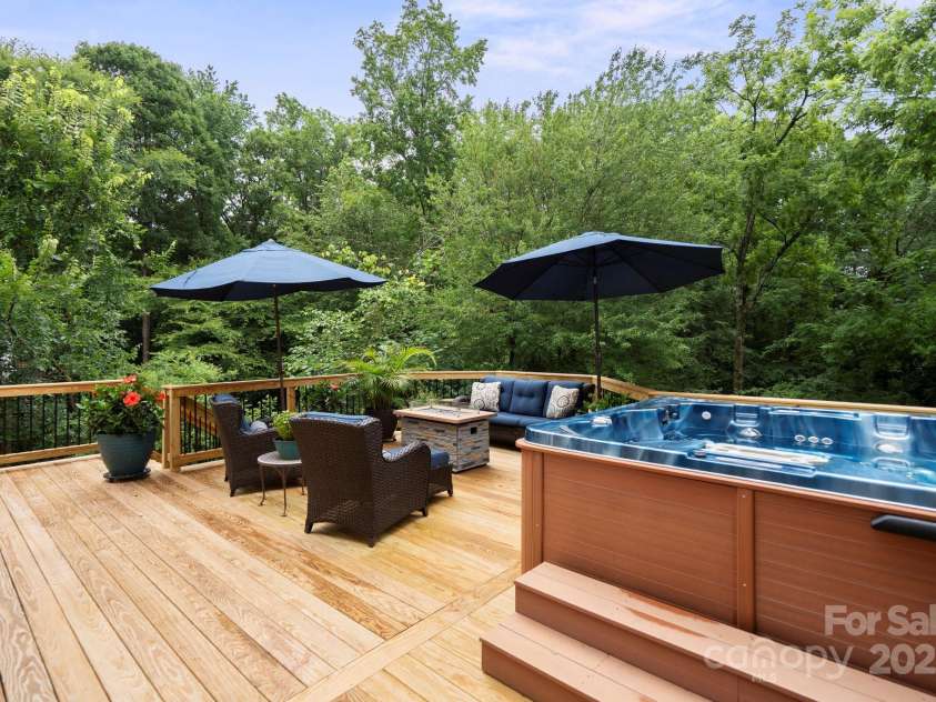10108 Bayart Way, Huntersville, NC 28078.  MLS# CAR4280969, YatesRealty ID 27084. Show-stopping new back deck with hot tub and lush, mature trees