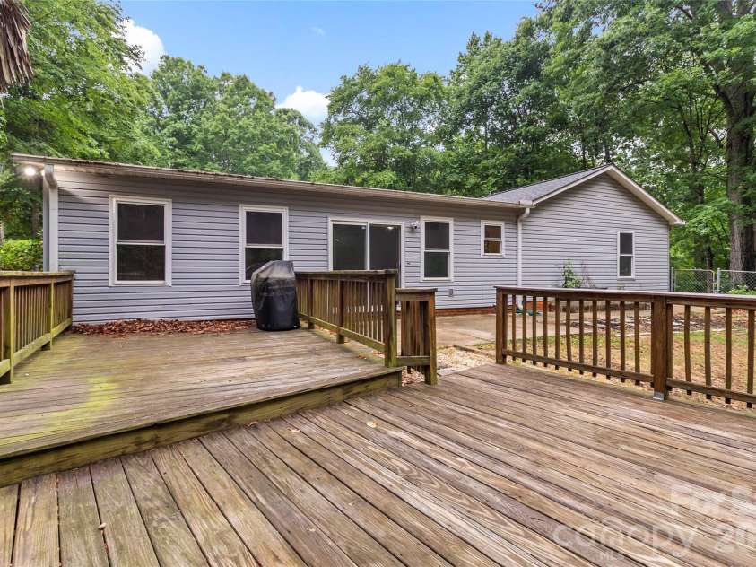 132 Lismark Drive, Mooresville, NC 28117.  MLS# CAR4351348, YatesRealty ID 27084. Back deck
