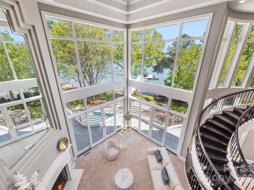 102 Eastham Court, Mooresville, NC 28117.  MLS# CAR4247937, YatesRealty ID 27092. 2nd floor balcony view of 2 story living room with long range lake views