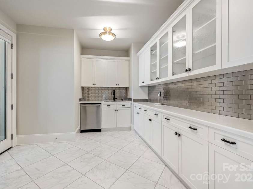 102 Eastham Court, Mooresville, NC 28117.  MLS# CAR4247937, YatesRealty ID 27092. Kitchen in basement near outdoor kitchen and grilling area