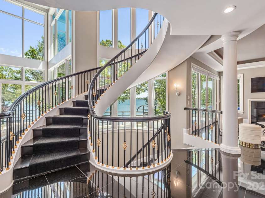 102 Eastham Court, Mooresville, NC 28117.  MLS# CAR4247937, YatesRealty ID 27092. Spiral staircase