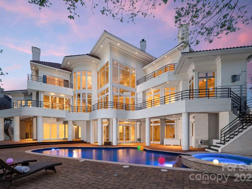 102 Eastham Court, Mooresville, NC 28117.  MLS# CAR4247937, YatesRealty ID 27092. Twilight from lake side