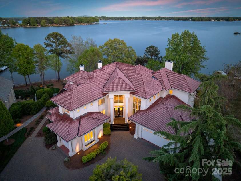 102 Eastham Court, Mooresville, NC 28117.  MLS# CAR4247937, YatesRealty ID 27092. Twilight of front with lake views