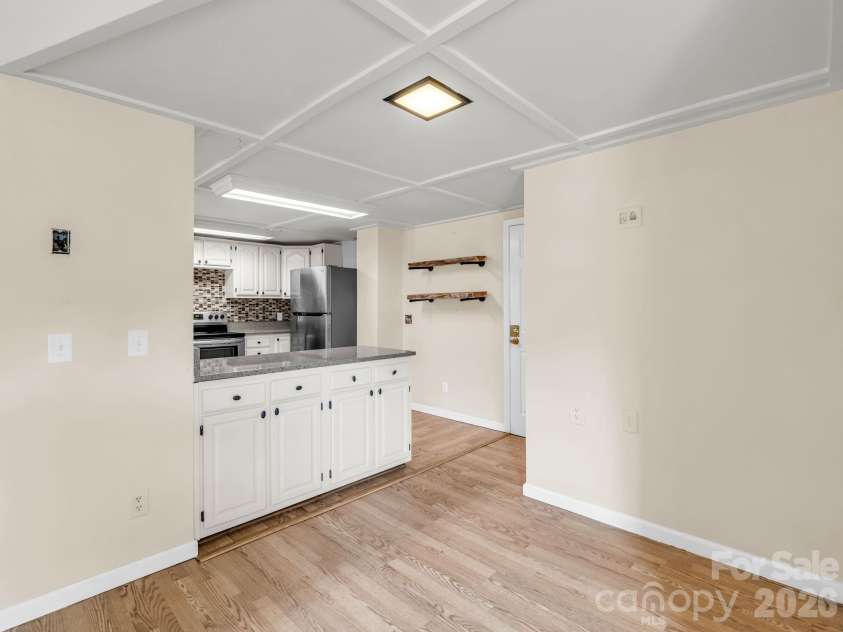 117 Willow Way, Hendersonville, NC 28739.  MLS# CAR4384780, YatesRealty ID 27096. View from living room into kitchen