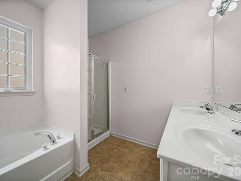 2001 Lake Vista Drive, Mount Holly, NC 28120.  MLS# CAR4363497, YatesRealty ID 27098. Primary Bathroom