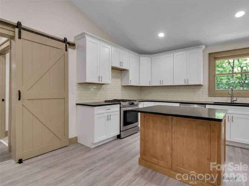 148 Cross Stitch Mountain Road, Sylva, NC 28779.  MLS# CAR4388302, YatesRealty ID 27099. Rendering of kitchen upon completion