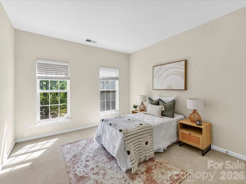 4179 Buckingham Drive, Fort Mill, SC 29707.  MLS# CAR4373781, YatesRealty ID 27110. Bright secondary bedroom with soft natural light, neutral tones, and ample space for comfortable living.