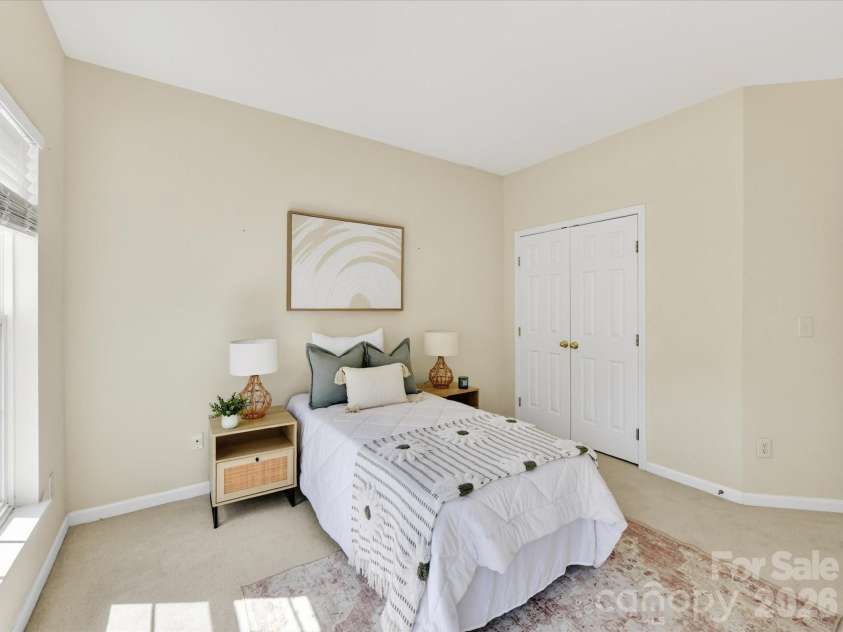 4179 Buckingham Drive, Fort Mill, SC 29707.  MLS# CAR4373781, YatesRealty ID 27110. Bright secondary bedroom with soft natural light, neutral tones, and ample space for comfortable living.