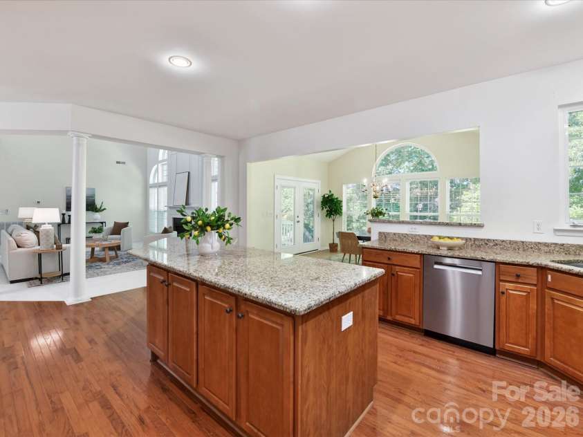 4179 Buckingham Drive, Fort Mill, SC 29707.  MLS# CAR4373781, YatesRealty ID 27110. Spacious chef’s kitchen featuring granite countertops, oversized island with seating, abundant cabinetry, and seamless flow to the breakfast area and main living spaces.