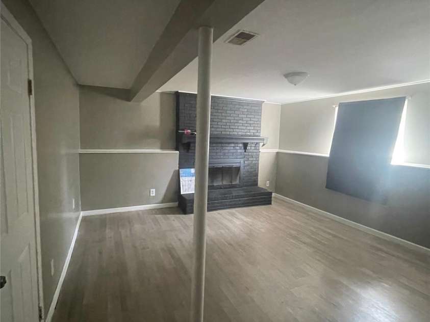 1221 Farmfield Lane, Charlotte, NC 28213.  MLS# CAR4351416, YatesRealty ID 27115. Downstairs living room