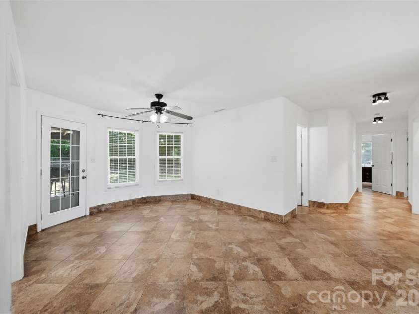 107 Cliffwood Drive, Hudson, NC 28638.  MLS# CAR4384762, YatesRealty ID 27118. Hallway leads to the laundry, full bath & 2 bedrooms as well as the Primary bedroom with en suite' bath.
