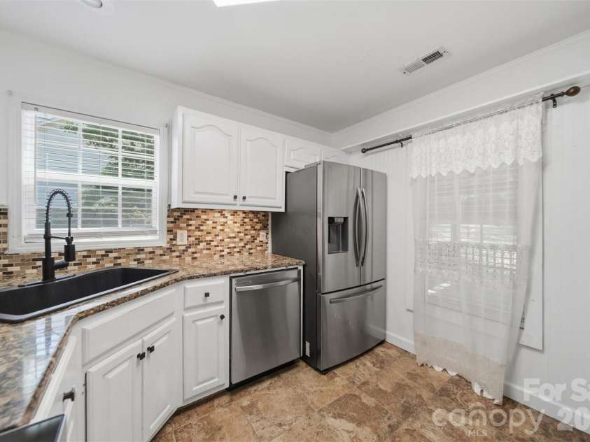 107 Cliffwood Drive, Hudson, NC 28638.  MLS# CAR4384762, YatesRealty ID 27118. Kitchen has a large window overlooking the covered deck.