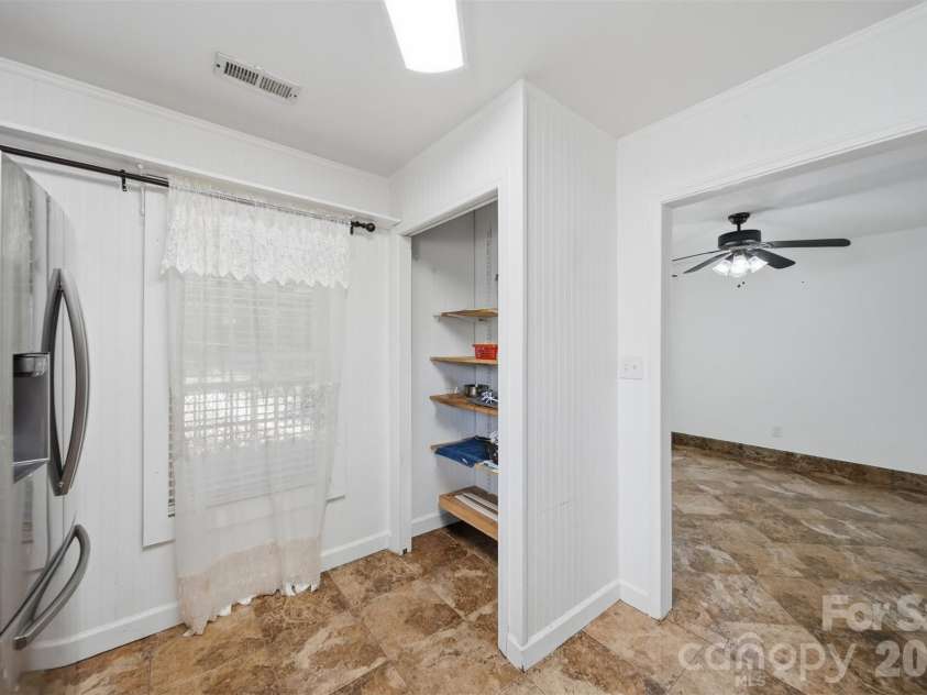 107 Cliffwood Drive, Hudson, NC 28638.  MLS# CAR4384762, YatesRealty ID 27118. Open pantry for additional storage.