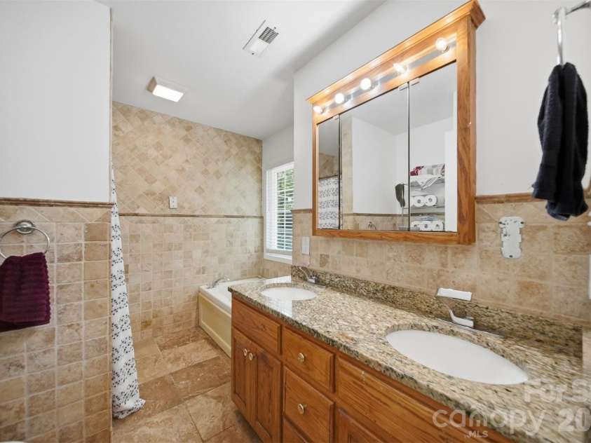 107 Cliffwood Drive, Hudson, NC 28638.  MLS# CAR4384762, YatesRealty ID 27118. Primary bath has double vanity, granite counters and step in shower!
