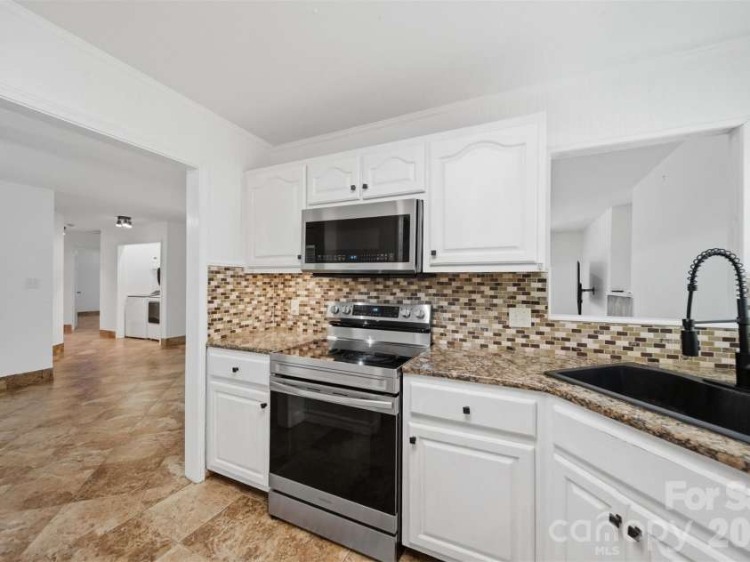107 Cliffwood Drive, Hudson, NC 28638.  MLS# CAR4384762, YatesRealty ID 27118. Smooth top electric range, Micro-hood, Dishwasher & refrigerator remain!