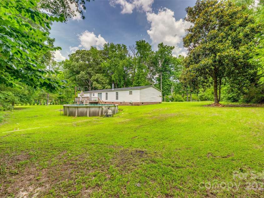 10435 Silver Mine Road, Fort Mill, SC 29707.  MLS# CAR4275041, YatesRealty ID 27125. OPEN TREE LINED LOT