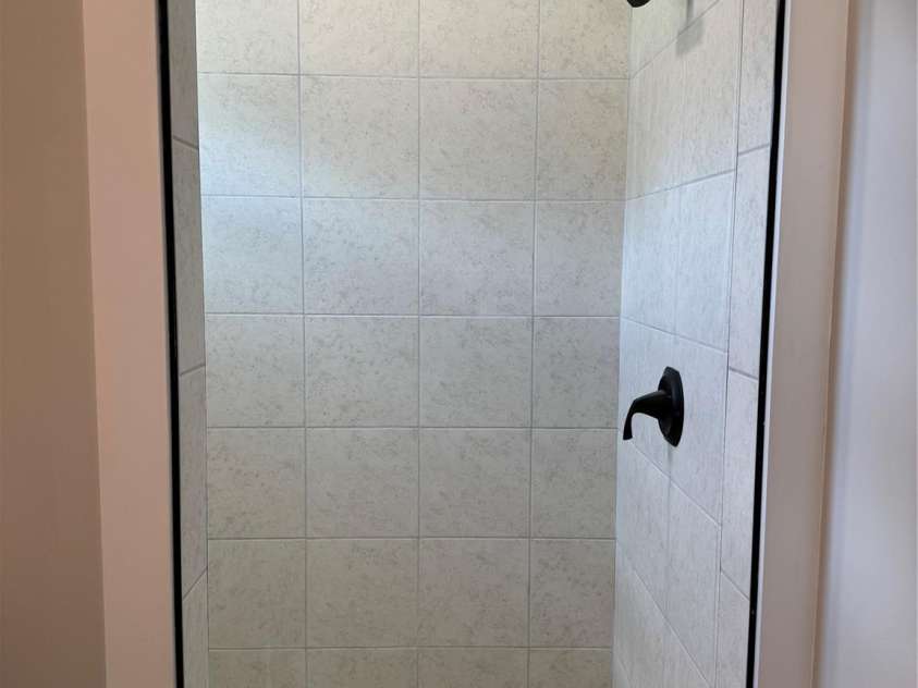 210 Baker Street, Jefferson, SC 29728.  MLS# CAR4279510, YatesRealty ID 27134. Beautiful roomy tiled shower