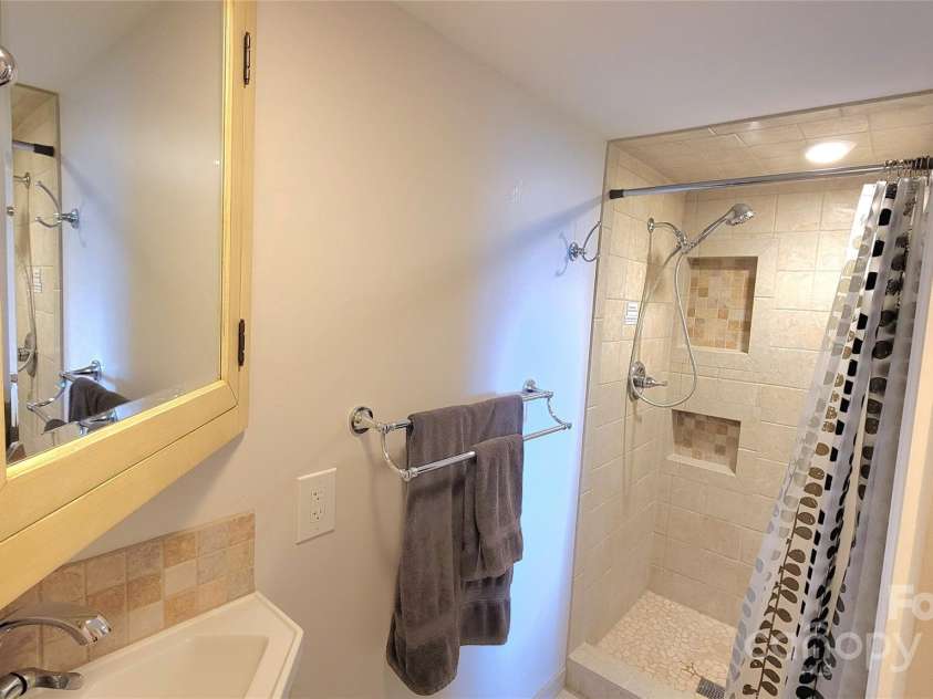 201 Cedar Mountain Road, Asheville, NC 28803.  MLS# CAR4281468, YatesRealty ID 27145. 3rd full bathroom on lower level with walk in shower