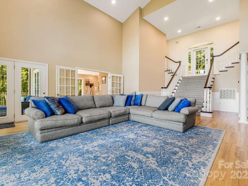 201 Cedar Mountain Road, Asheville, NC 28803.  MLS# CAR4281468, YatesRealty ID 27145. Grand staircase to living room, looking toward kitchen