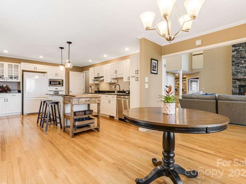 201 Cedar Mountain Road, Asheville, NC 28803.  MLS# CAR4281468, YatesRealty ID 27145. Kitchen off living room with lots of storage. 2 additional pantries are not in the photo