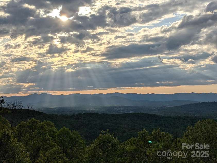 201 Cedar Mountain Road, Asheville, NC 28803.  MLS# CAR4281468, YatesRealty ID 27145. Owner's photo of sun rays