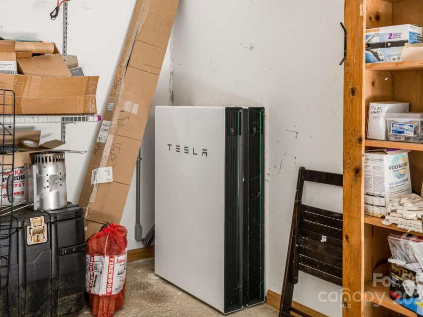 201 Cedar Mountain Road, Asheville, NC 28803.  MLS# CAR4281468, YatesRealty ID 27145. Tesla charging station in the garage.