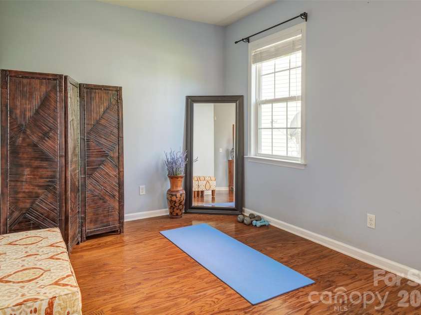 7 Breyerton Court, Asheville, NC 28804.  MLS# CAR4380196, YatesRealty ID 27146. Dedicated space in master for exercise, relaxing or office space