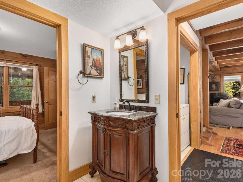 102 Carriage Drive, Fairview, NC 28730.  MLS# CAR4379033, YatesRealty ID 27149. Easy Floorplan Connects Primary Suite, Bathroom, And Laundry