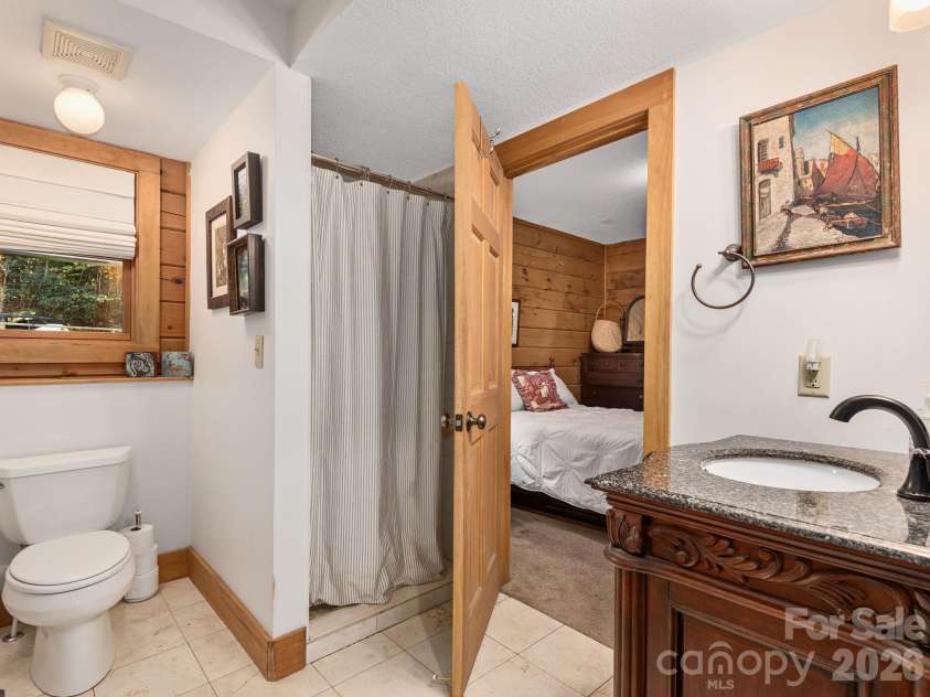 102 Carriage Drive, Fairview, NC 28730.  MLS# CAR4379033, YatesRealty ID 27149. En-Suite Primary Bathroom With Shared Access