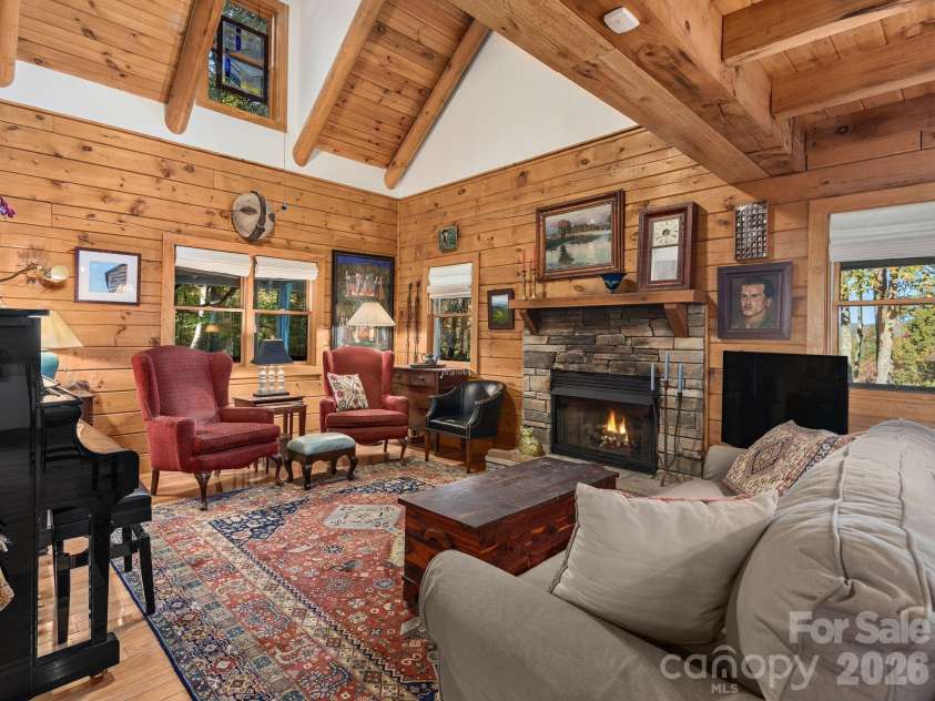 102 Carriage Drive, Fairview, NC 28730.  MLS# CAR4379033, YatesRealty ID 27149. Quintessential Mountain Cabin Interior With Elevated Finishes And Vaulted Ceilings. Gather Around The Stone Fireplace And Take In Views Of The Surrounding Mountains.
