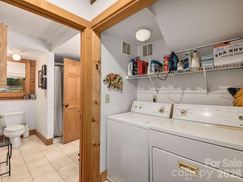 102 Carriage Drive, Fairview, NC 28730.  MLS# CAR4379033, YatesRealty ID 27149. Spacious Laundry Area Conveniently Located Off Main Level Bathroom