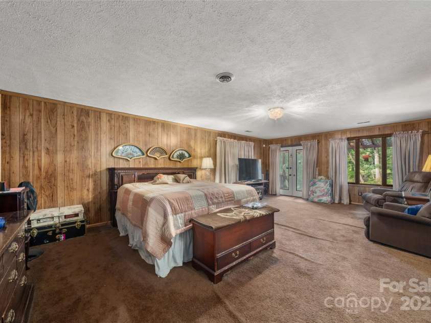 335 Lake Circle Drive, Hendersonville, NC 28792.  MLS# CAR4295963, YatesRealty ID 2715. Primary bedroom