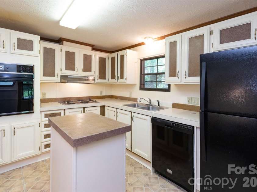 1010 Sharon Ridge Road, Fairview, NC 28730.  MLS# CAR4379788, YatesRealty ID 27153. Kitchen with island