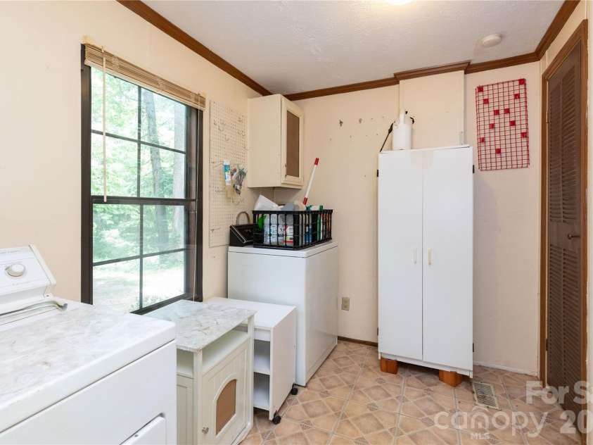 1010 Sharon Ridge Road, Fairview, NC 28730.  MLS# CAR4379788, YatesRealty ID 27153. Laundry room