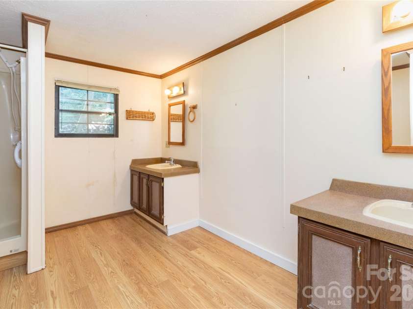 1010 Sharon Ridge Road, Fairview, NC 28730.  MLS# CAR4379788, YatesRealty ID 27153. Primary bathroom