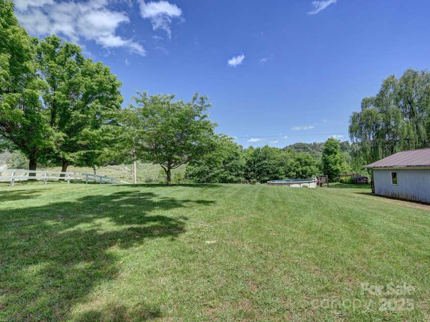 522 Bailey Mountain Road, Mars Hill, NC 28754.  MLS# CAR4260216, YatesRealty ID 27162. Side Yard