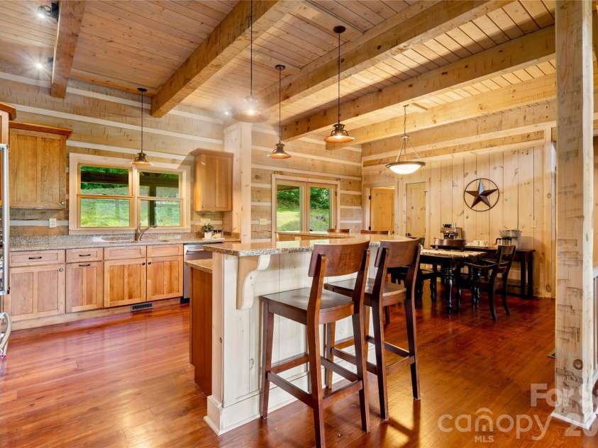170 Cradling Cove, Waynesville, NC 28785.  MLS# CAR4387872, YatesRealty ID 27165. Island in the kitchen - solid surfaces