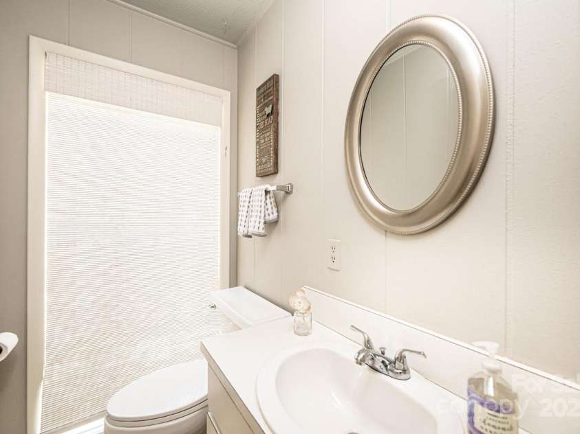 902 Cherokee Place, Lenoir, NC 28645.  MLS# CAR4277331, YatesRealty ID 27183. Half Bath off kitchen and laundry