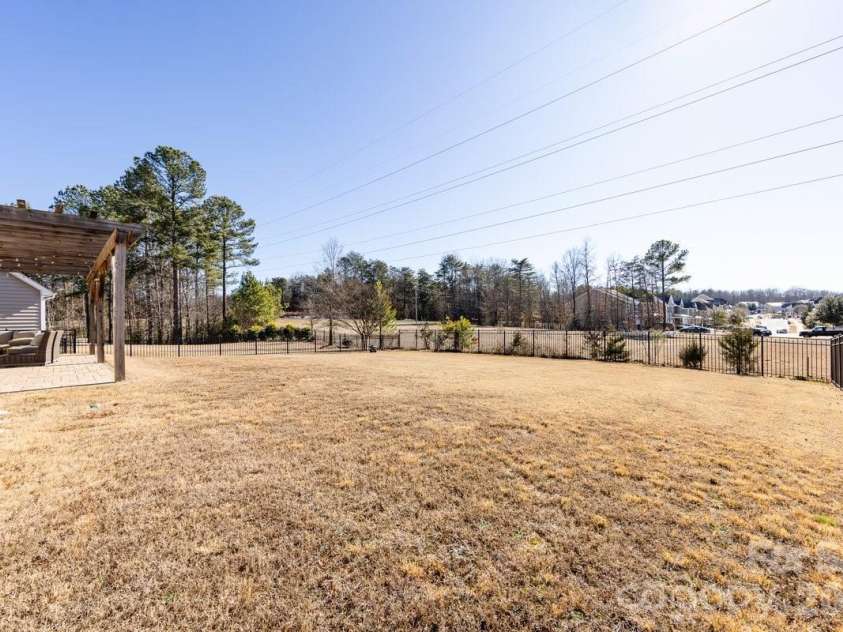 8931 Happiness Road, Harrisburg, NC 28075.  MLS# CAR4331689, YatesRealty ID 27184. Huge Fenced Backyard