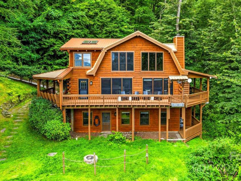 1933 Laurel Ridge Road, Maggie Valley, NC 28751.  MLS# CAR4281523, YatesRealty ID 27189. Live in the Maggie Dream! Create the next chapter of your store at this magnificently-updated, luxury log cabin that sits above the Maggie Valley Country Club at 4,500ft elevation.