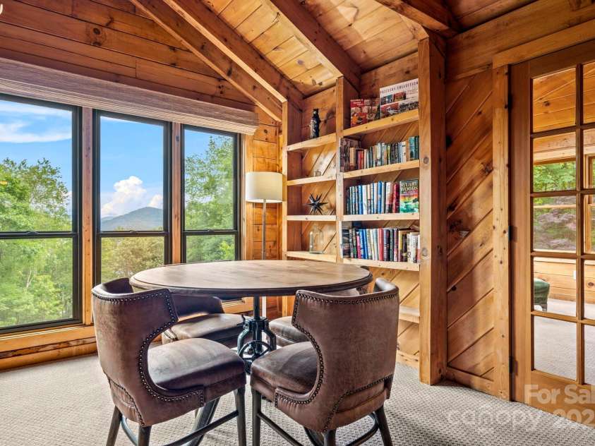 1933 Laurel Ridge Road, Maggie Valley, NC 28751.  MLS# CAR4281523, YatesRealty ID 27189. Puzzles by the window.