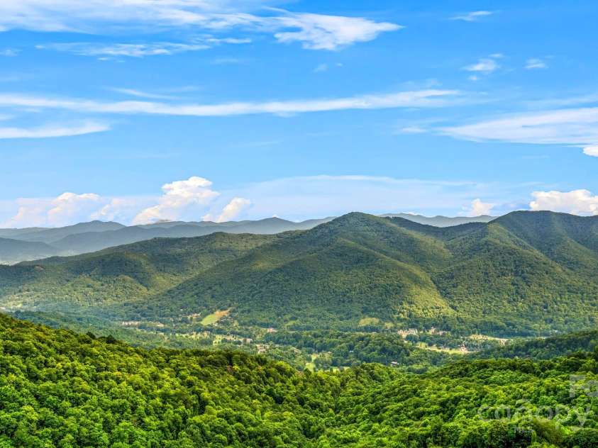 1933 Laurel Ridge Road, Maggie Valley, NC 28751.  MLS# CAR4281523, YatesRealty ID 27189. Secluded, yet, close to all area conveniences. Located in the Laurel Ridge Community above the Maggie Valley Country Club.