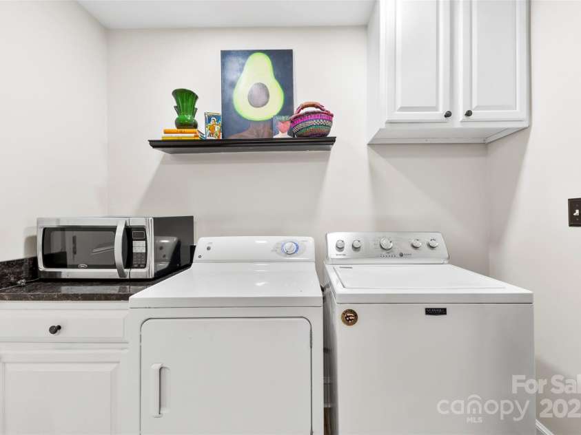 1126 Woodlawn Road, Charlotte, NC 28209.  MLS# CAR4281650, YatesRealty ID 27192. Laundry area off kitchen.