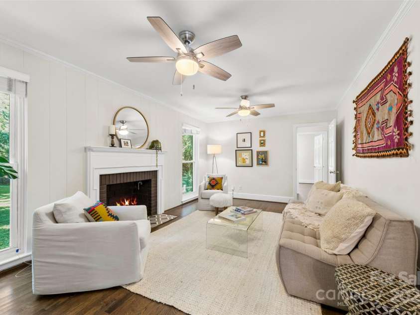 1126 Woodlawn Road, Charlotte, NC 28209.  MLS# CAR4281650, YatesRealty ID 27192. Living room with large windows.
