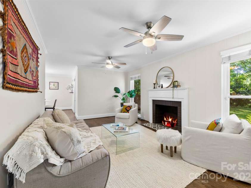 1126 Woodlawn Road, Charlotte, NC 28209.  MLS# CAR4281650, YatesRealty ID 27192. Living room with large windows.