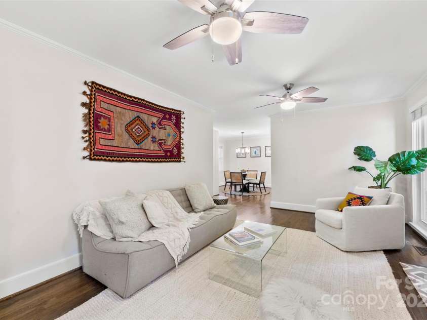 1126 Woodlawn Road, Charlotte, NC 28209.  MLS# CAR4281650, YatesRealty ID 27192. Living room with large windows.